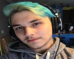 He often dyes his hair in bright colors like pink and green.